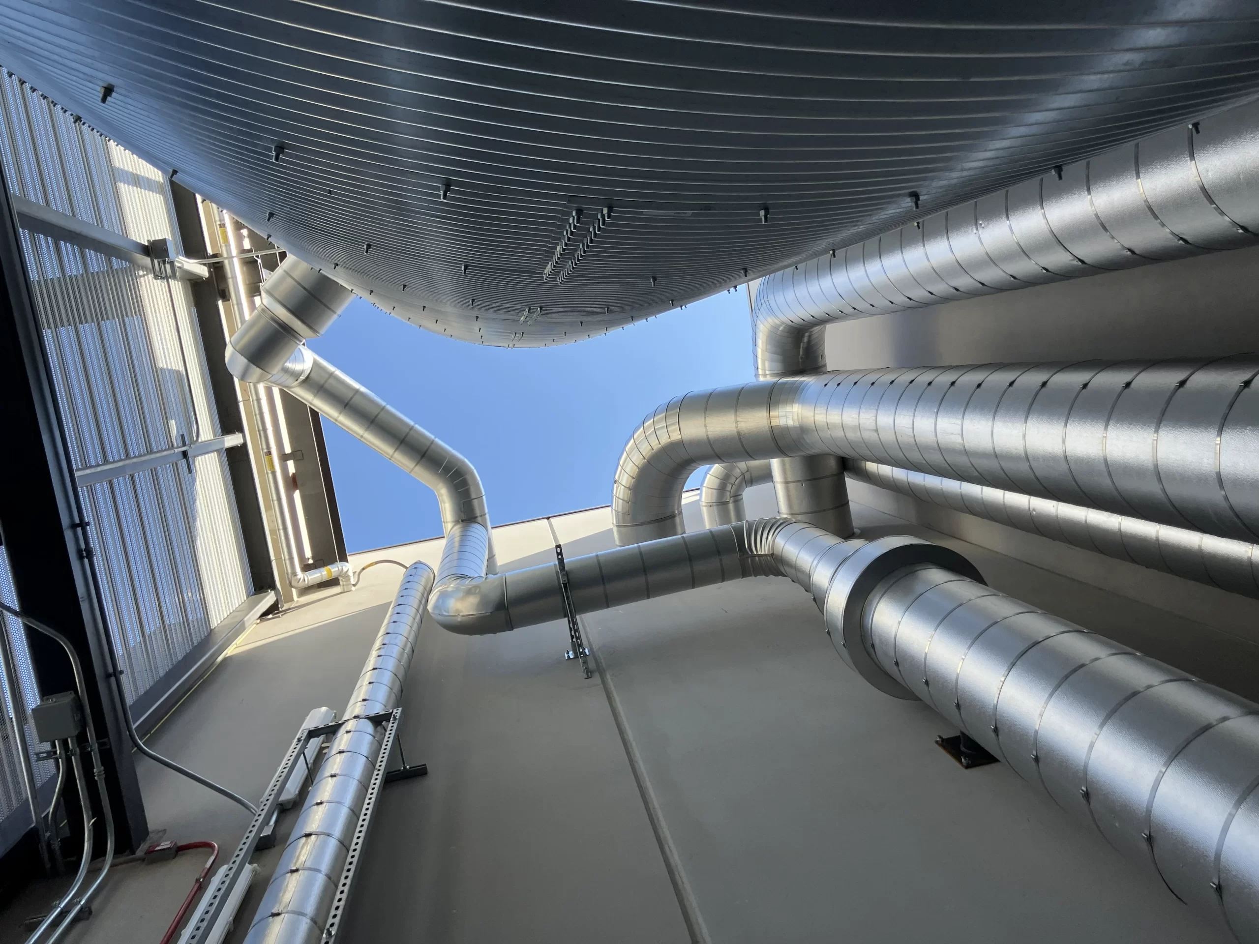 Tanks behind architectural metal grate