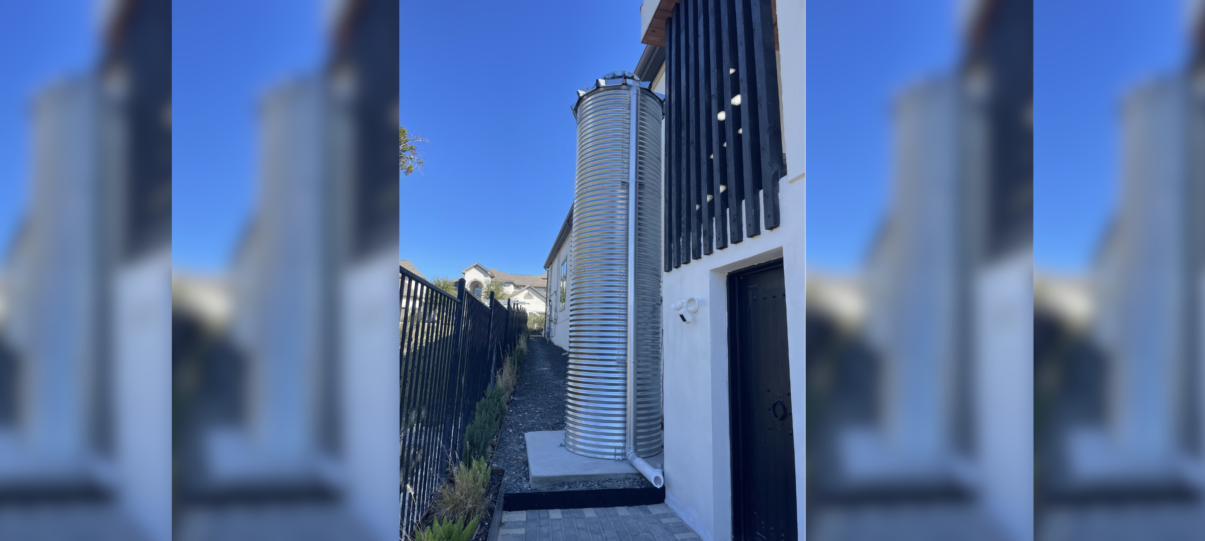 CorGal 405.5 Rainwater Harvesting Tank behind a Building.
